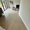 Beige stone floor tiles in a luxury high end lounge area.